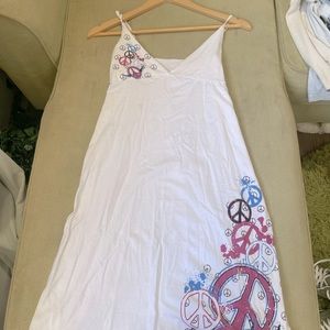 I am selling this Flowy, peace sign, beach styled dress.